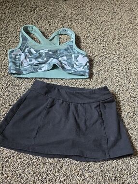 art class green camo sports bra and black skort